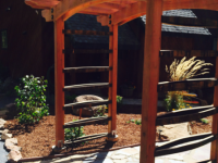 Redwood arbor with whiskey barrel staves