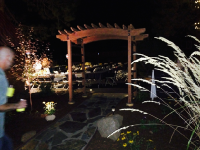 Redwood arbor with whiskey barrel staves