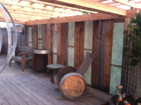 Arbor with recycled boarded fence