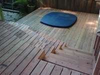 Redwood Deck with Built-in Hot Tub and Curved Stairs