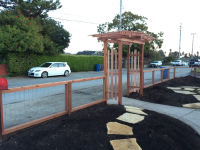 Hogwire mesh fence with arbor